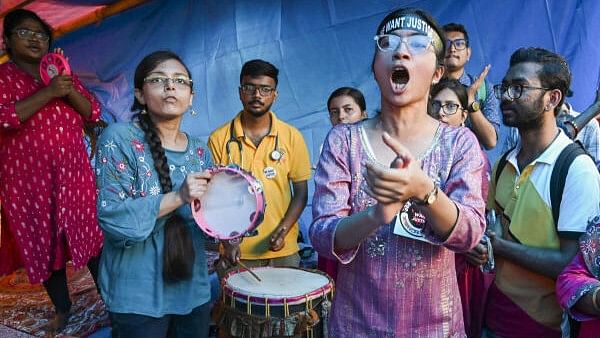 <div class="paragraphs"><p>Junior doctors raise slogans during their ongoing protest against R G Kar Medical College and Hospital incident, in Kolkata, Monday.&nbsp;</p></div>