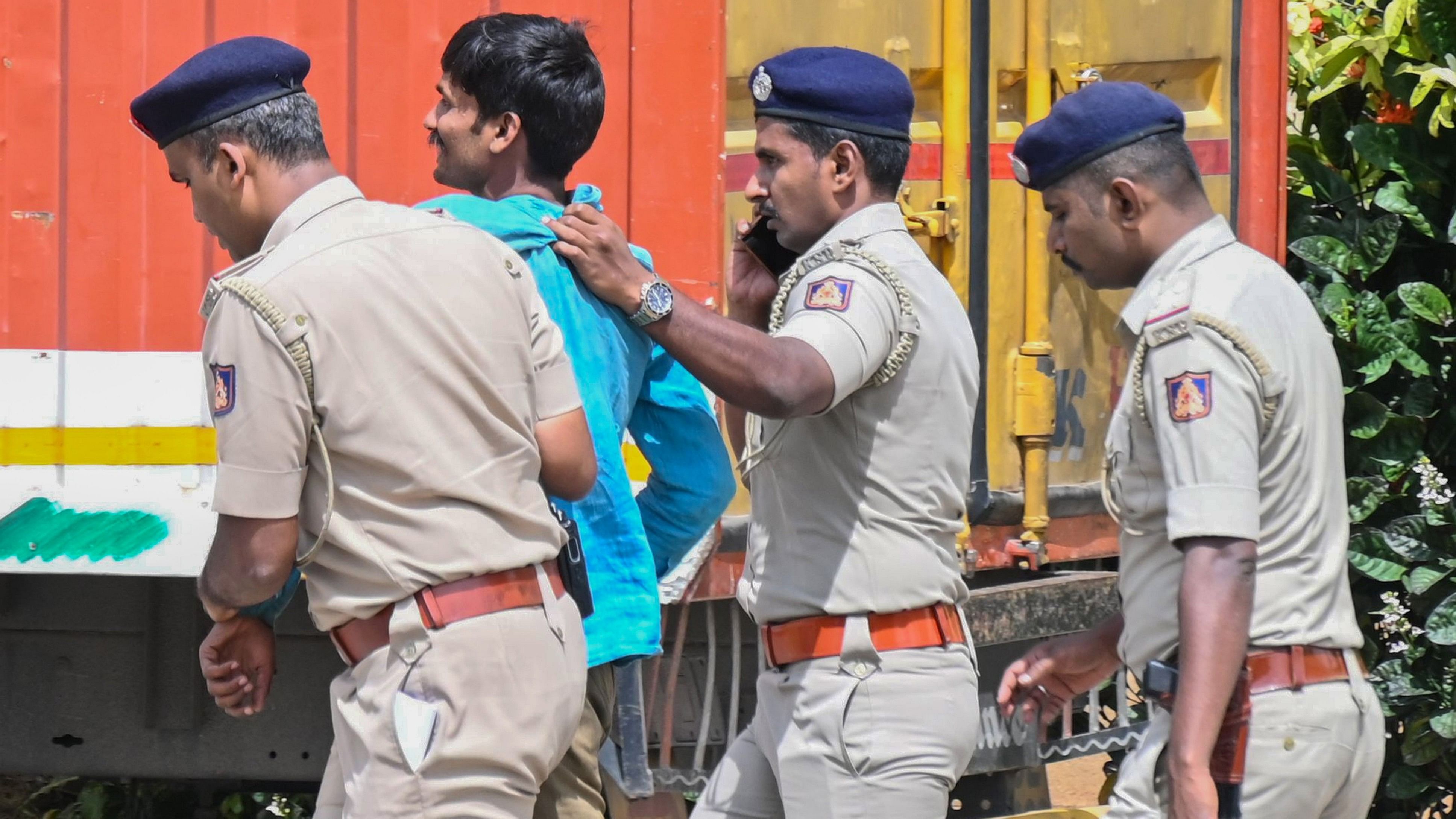 <div class="paragraphs"><p>Police whisk away&nbsp;Mahadev Nayak from the Vidhana Soudha&nbsp;premises. </p></div>