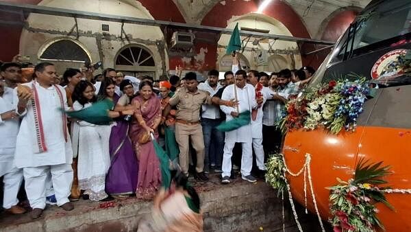 <div class="paragraphs"><p>BJP MLA Sarita Bhadauriya being helped on to the platform after falling on the tracks during the flag-off ceremony of the Agra-Varanasi Vande Bharat train, in Etawah in UP on Monday. </p></div>