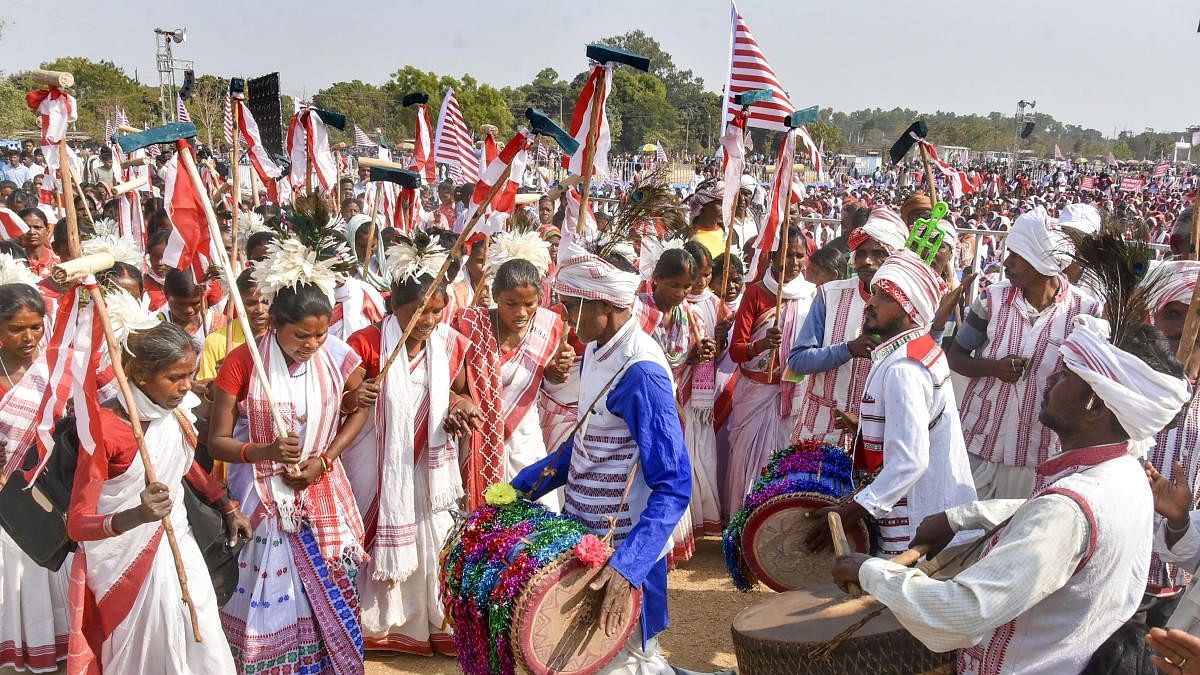 <div class="paragraphs"><p>People from the Sarna community play traditional drums.</p></div>