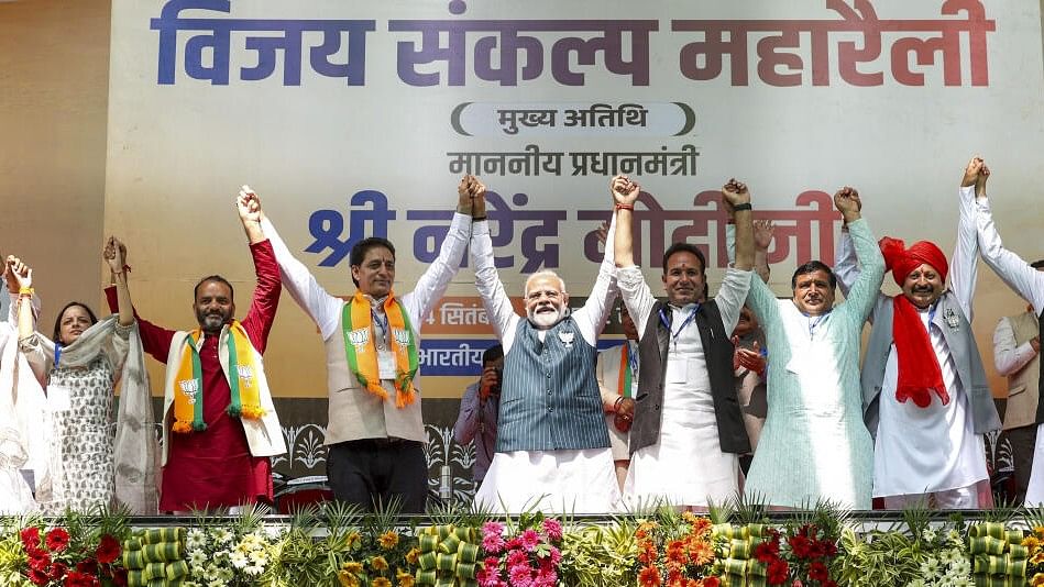 <div class="paragraphs"><p>Prime Minister Narendra Modi with others during a public meeting ahead of the upcoming Jammu and Kashmir Assembly elections, in Doda district.</p></div>