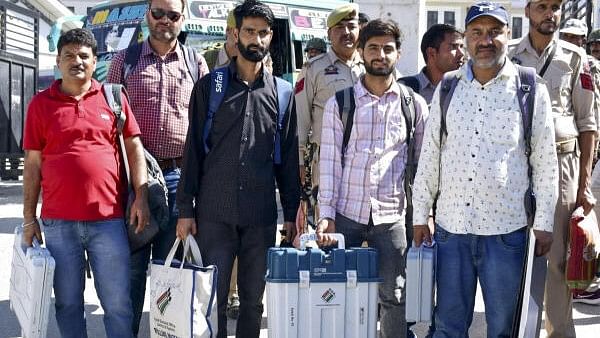 <div class="paragraphs"><p>Polling officials leave for their respective polling stations on the eve of first phase of the Jammu and Kashmir Assembly election, in Kishtwar district, Tuesday, Sept. 17, 2024.</p></div>