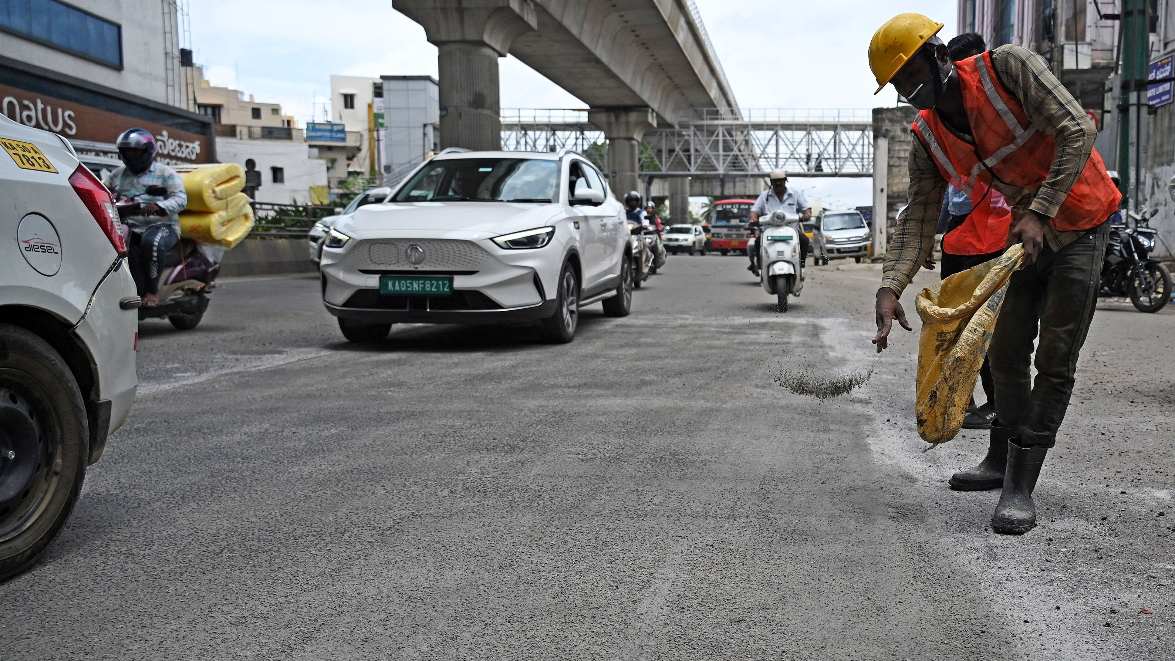 <div class="paragraphs"><p>A worker undertakes road patching on the busy Mysuru Road. But such repairs may not withstand heavy volumes of traffic. </p></div>