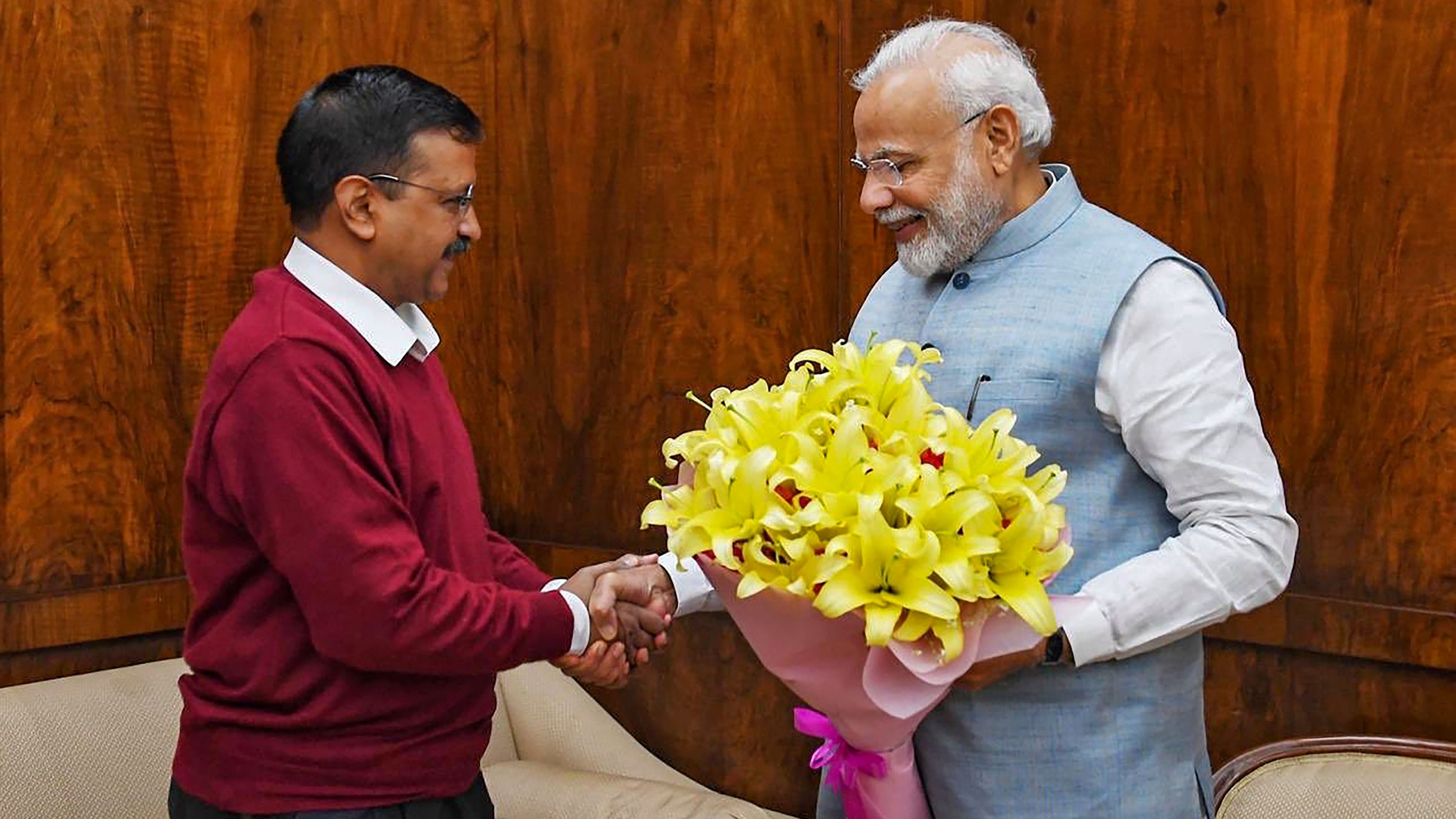 <div class="paragraphs"><p>Prime Minister Narendra Modi shakes hands with Delhi Chief Minister Arvind Kejriwal</p></div>