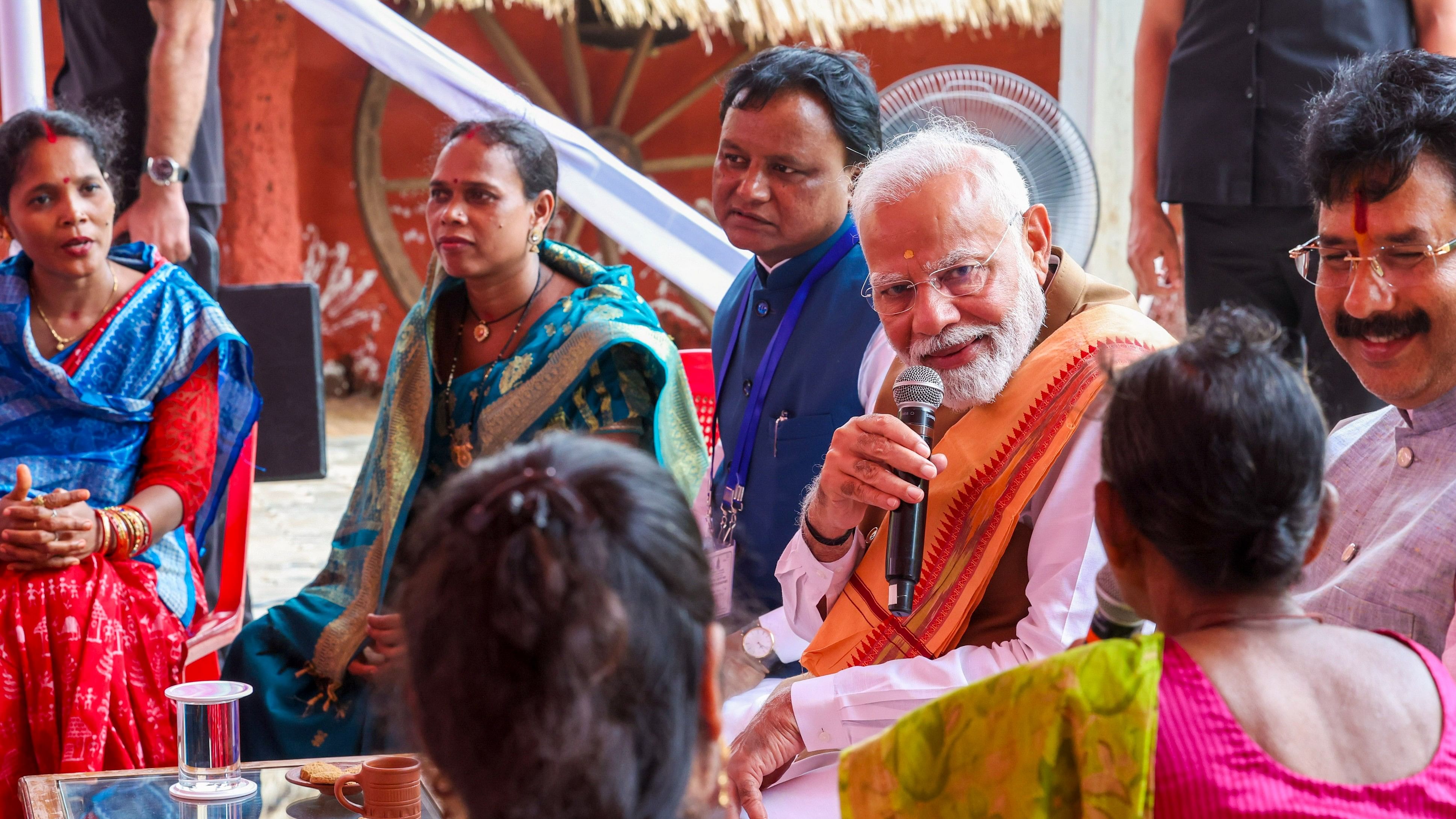 <div class="paragraphs"><p>Prime Minister Narendra Modi during an interaction with beneficiaries of Pradhan Mantri Awas Yojana, in Bhubaneswar.</p></div>