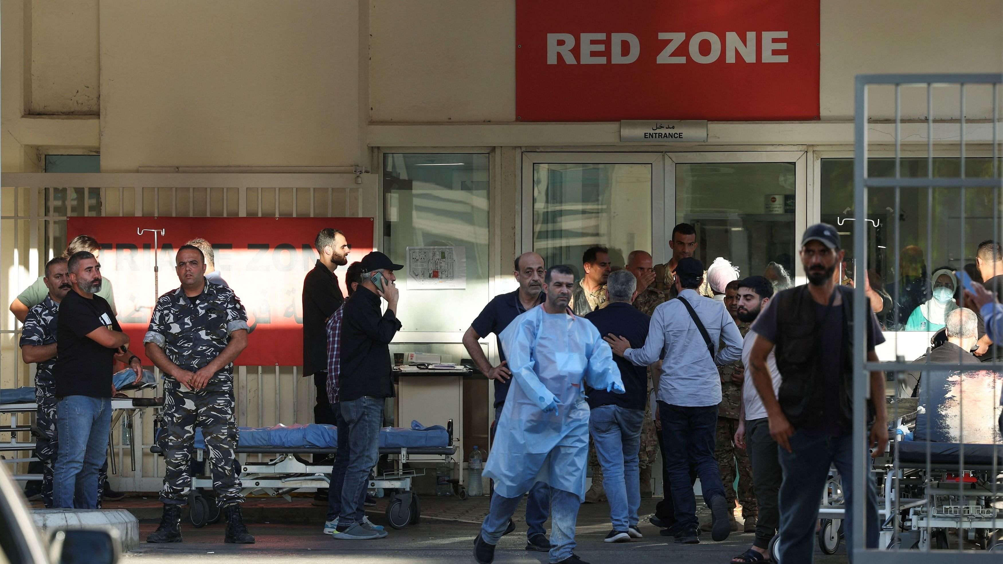 <div class="paragraphs"><p>People gather outside a hospital, as more than 1,000 people, including Hezbollah fighters and medics, were wounded on Tuesday when the pagers they use to communicate exploded across Lebanon, according to a security source, in Beirut, Lebanon September 17, 2024.</p></div>