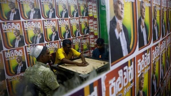 <div class="paragraphs"><p>Supporters of Sri Lanka's president Ranil Wickremesinghe play carrom inside an election campaign office ahead of the upcoming presidential election, scheduled for September 21, in Colombo, Sri Lanka</p></div>