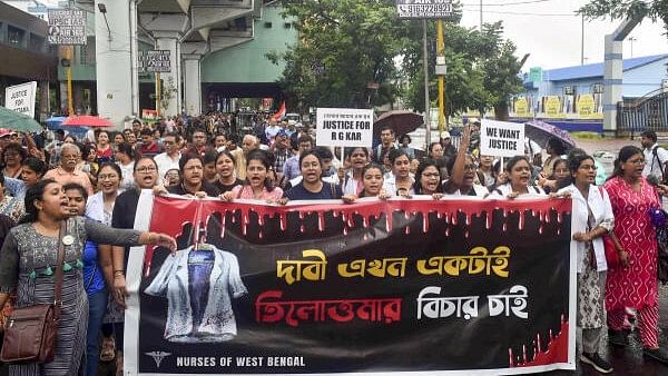 <div class="paragraphs"><p>Medics take part in a protest march to Swasthya Bhavan over the alleged sexual assault and murder of a trainee doctor, in Kolkata, Sunday, Sept. 15, 2024. </p></div>