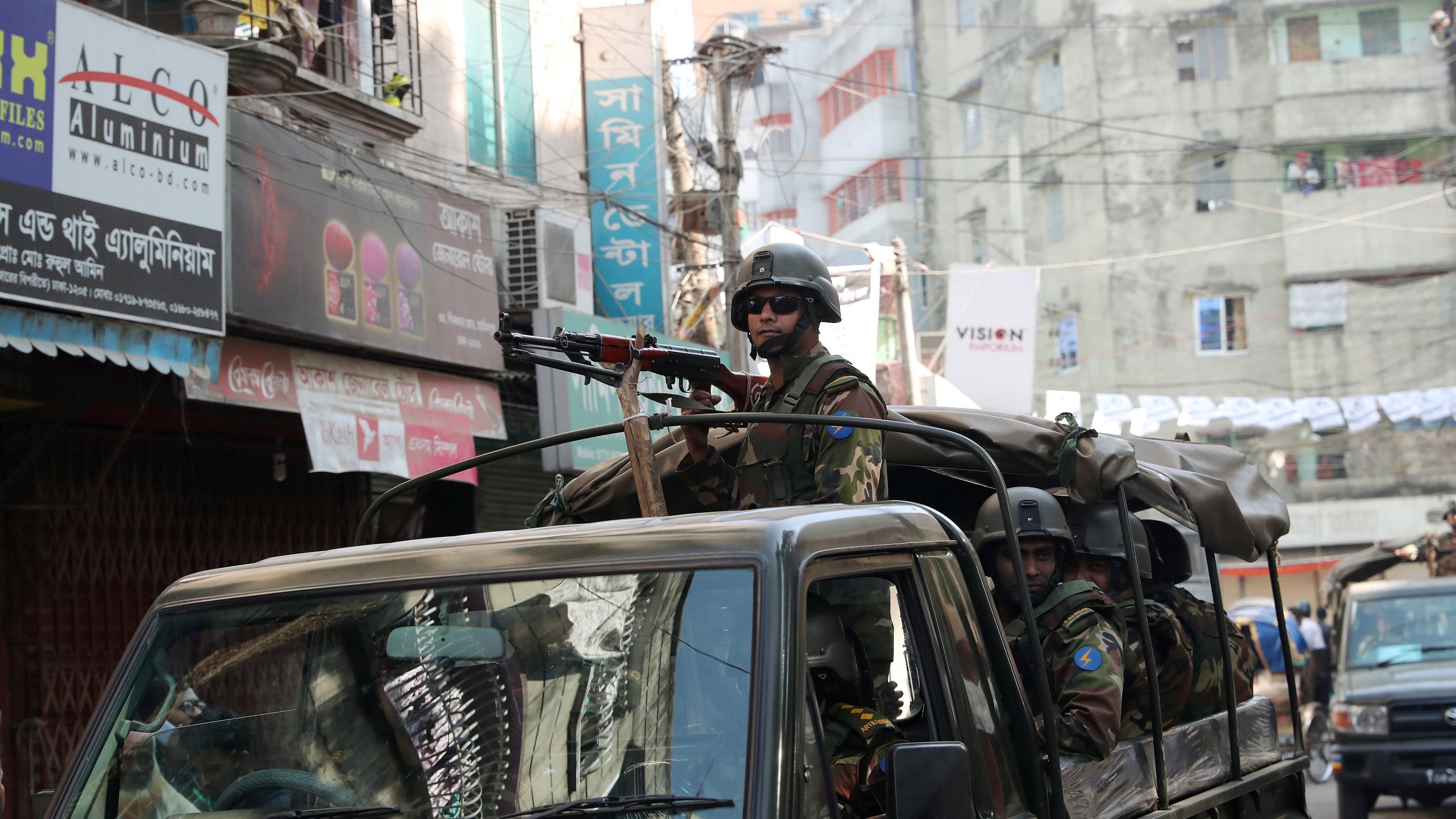 <div class="paragraphs"><p>An army vehicle patrols the  in Dhaka</p></div>