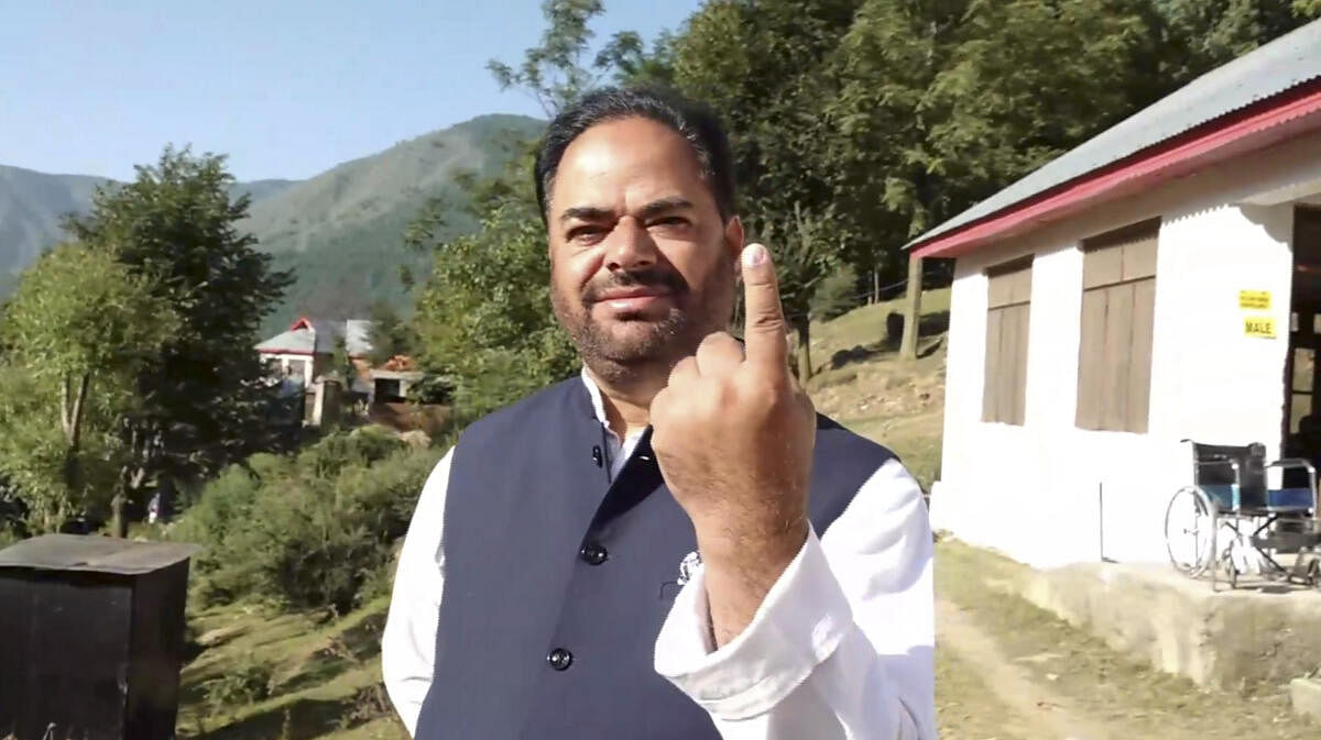 <div class="paragraphs"><p>Vikar Rasool Wani shows his finger marked with indelible ink.</p></div>