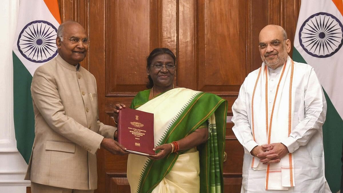 <div class="paragraphs"><p>President Droupadi Murmu being presented a report on simultaneous elections in the country by former president Ram Nath Kovind who heads High-Level Committee (HLC) on 'One Nation, One Election', and Home Minister Amit Shah, at Rashtrapati Bhavan.</p></div>