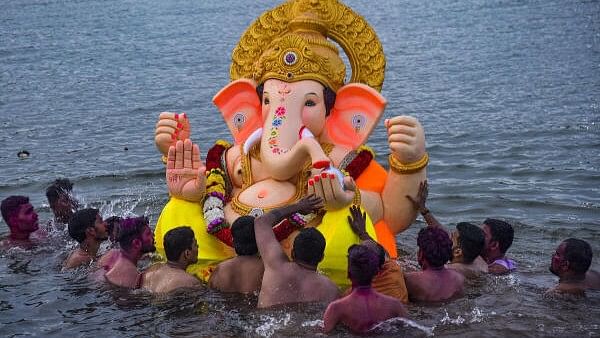 <div class="paragraphs"><p>Devotees immerse an idol of Lord Ganesh after the conclusion of Ganesh Chaturthi festival, Maharashtra.</p></div>