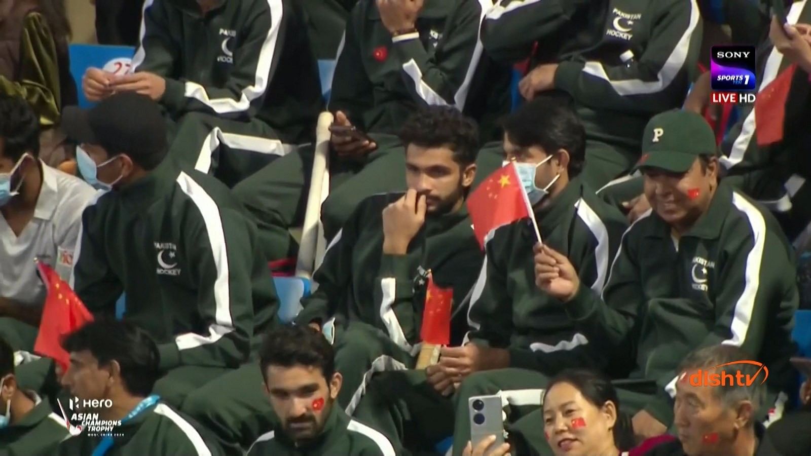 <div class="paragraphs"><p>Pakistan hockey players wave China flags</p></div>