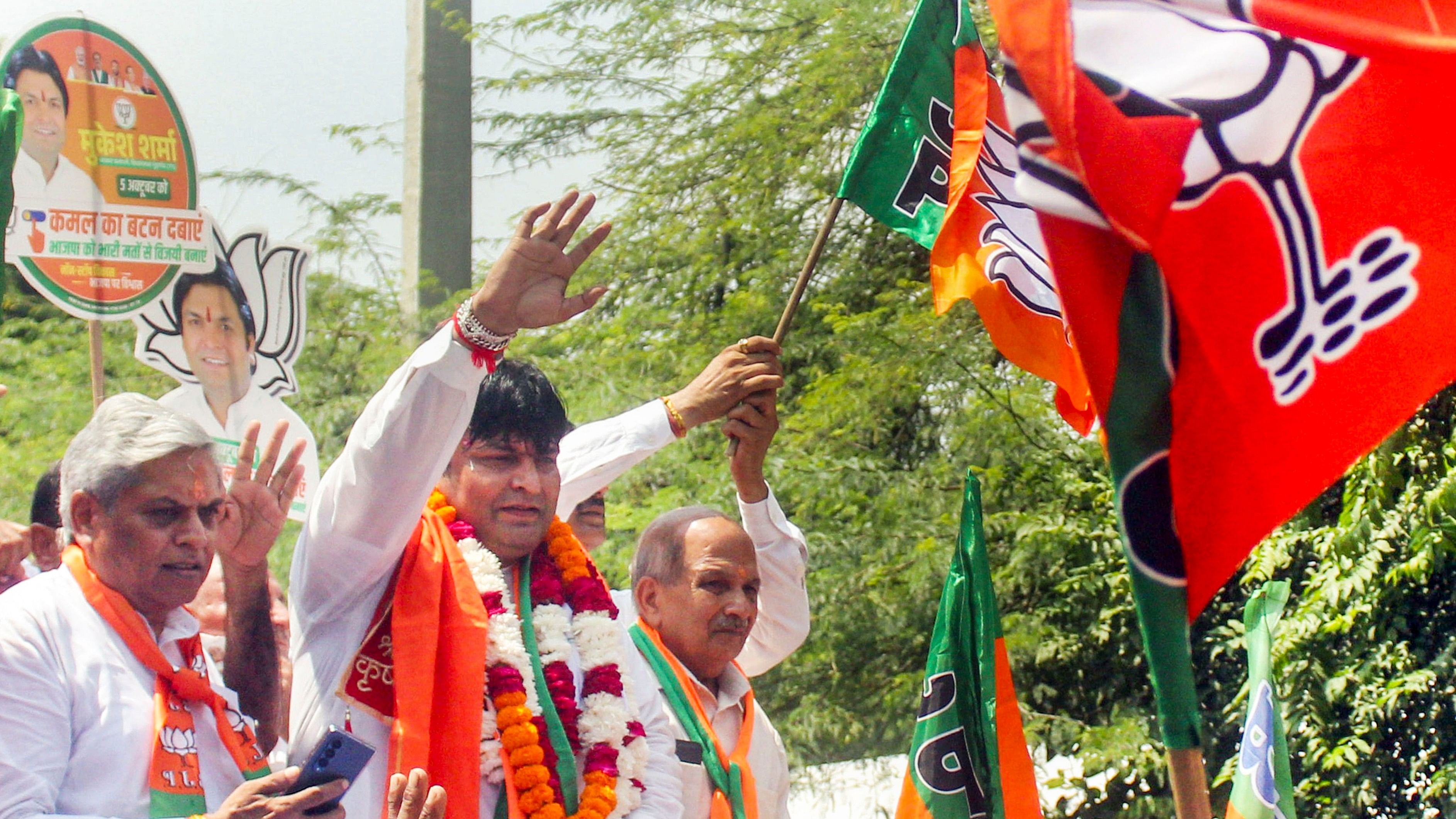 <div class="paragraphs"><p>BJP candidate Mukesh Sharma from Gurugram constituency during a roadshow before filing his nomination papers for Haryana Assembly election, in Gurugram, Tuesday, September 10, 2024. </p></div>