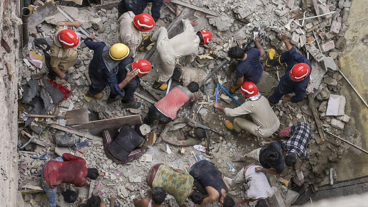 <div class="paragraphs"><p>Rescue work underway after a two-storey house collapsed in Bapa Nagar area of Karol Bagh, in New Delhi.</p></div>