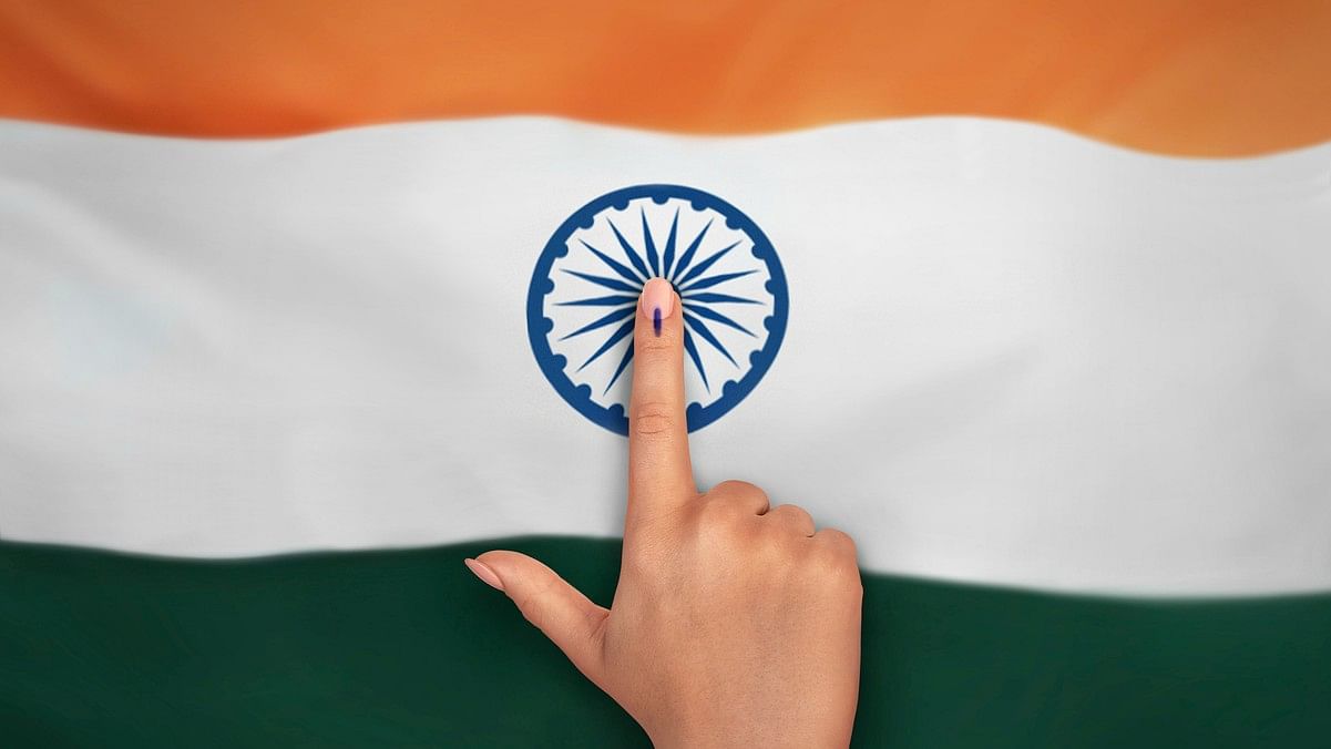 <div class="paragraphs"><p>Illustration showing the Indian flag and the finger of a voter marked with indelible ink. For representational purposes.</p></div>