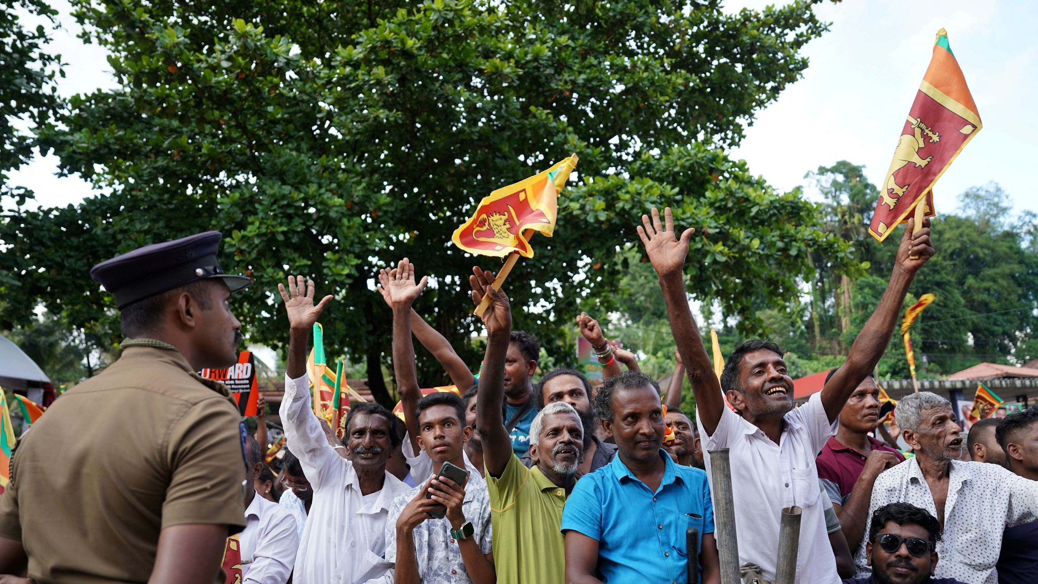 <div class="paragraphs"><p>Supporters of the independent presidential candidate Ranil Wickremesinghe wave Sri Lanka's national flags during an election rally ahead of the upcoming presidential election in Ratnapura, Sri Lanka, September 15, 2024. </p></div>