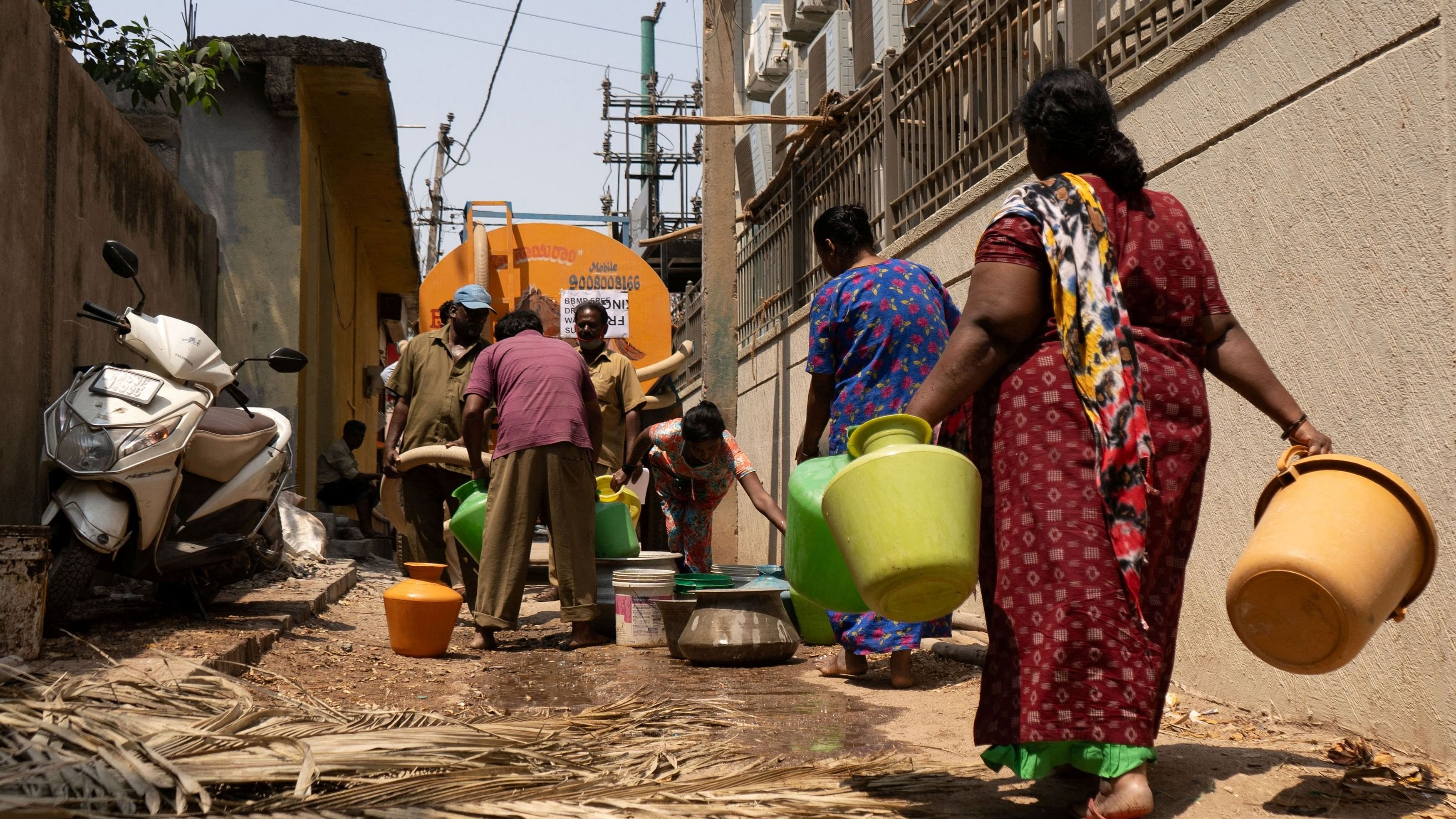 <div class="paragraphs"><p>File Photo: Residents arrive to get their containers filled with drinking water from a water tanker supplied by Bruhat Bengaluru Mahanagara Palike in a neighbourhood that is facing severe water scarcity, in the south of Bengaluru, India, March 11, 2024. </p></div>