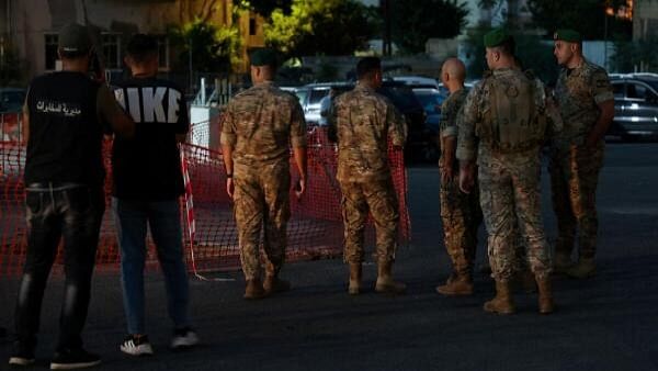 <div class="paragraphs"><p>Lebanese army members prepare to carry out a controlled explosion of a walkie-talkie device outside the American University of Beirut Medical Center, in Beirut, Lebanon September 18, 2024.</p></div>