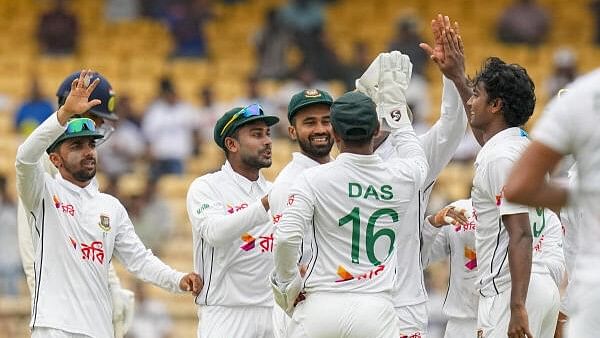 <div class="paragraphs"><p>Bangladesh’s Hasan Mahmud celebrates with teammates after taking the wicket of India’s Shubman Gill during the first test cricket match of a series between India and Bangladesh, at the MA Chidambaram Stadium, in Chennai</p></div>