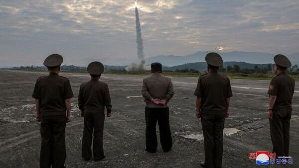 <div class="paragraphs"><p>North Korean leader Kim Jong-un looks on during the test of what KCNA described as a new tactical ballistic missile</p></div>