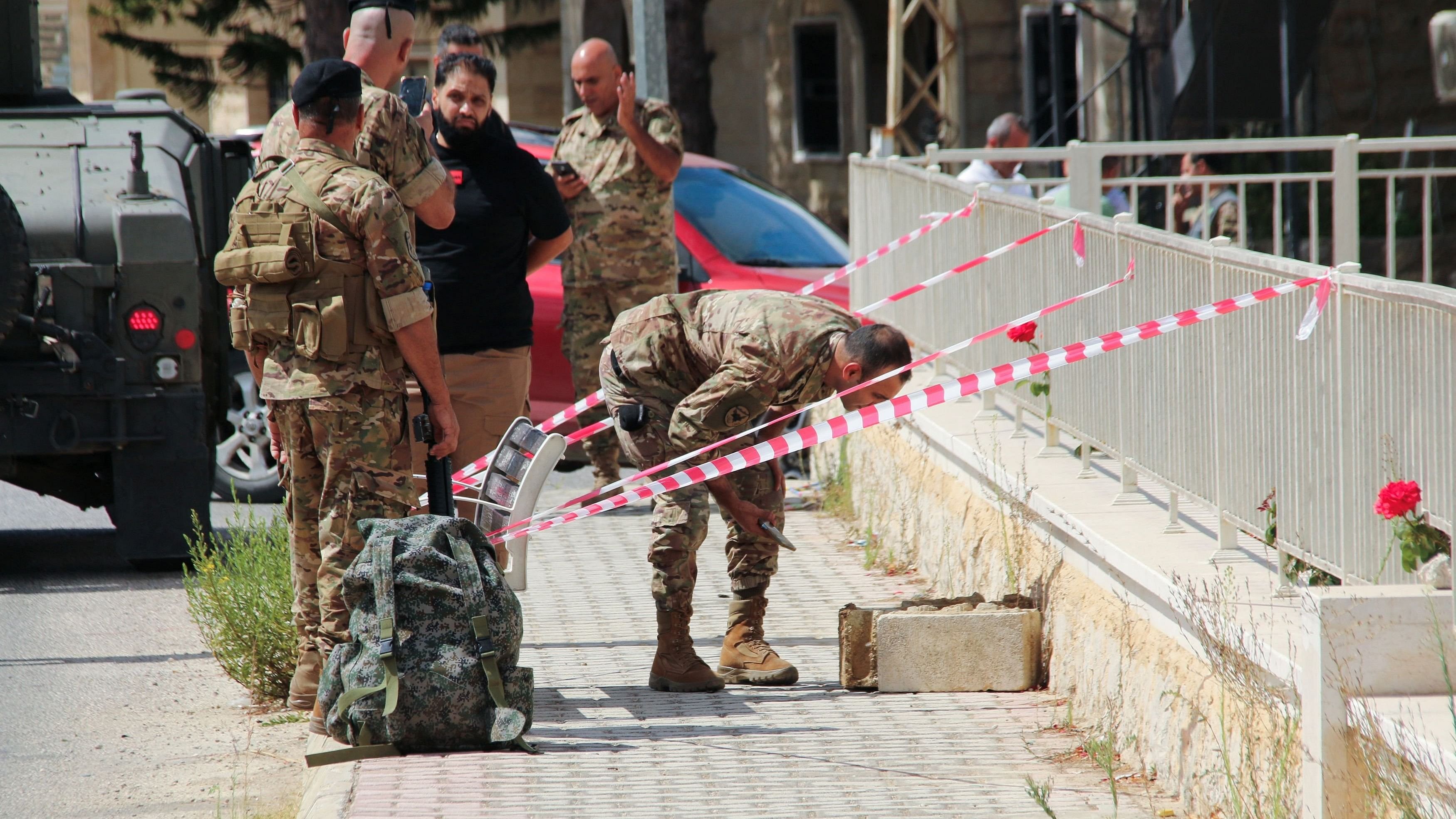 <div class="paragraphs"><p>Lebanese army members prepare to carry out a controlled explosion of a battery of a communications device in the town of Qlayaa, southern Lebanon, September 19, 2024. </p></div>