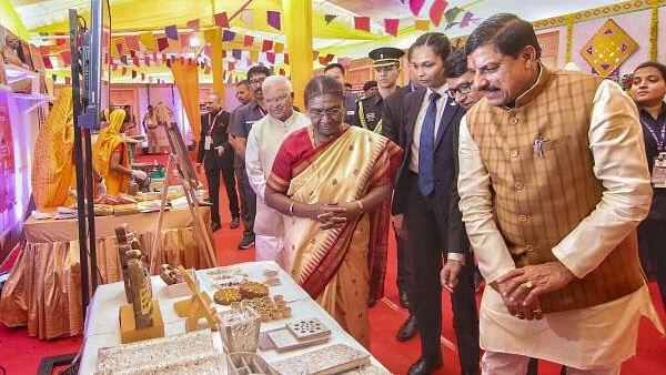 <div class="paragraphs"><p>President Droupadi Murmu with Madhya Pradesh Chief Minister Mohan Yadav visits an exhibition during a felicitation ceremony for sanitation workers, in Ujjain, Madhya Pradesh</p></div>