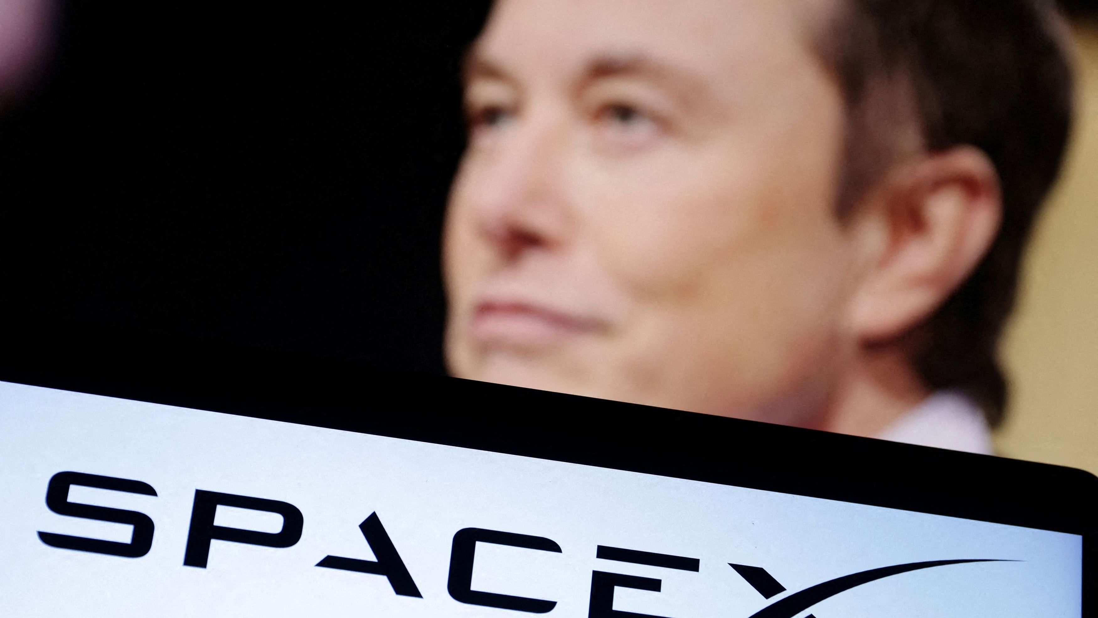 <div class="paragraphs"><p>SpaceX logo and Elon Musk photo are seen in this illustration.</p></div>