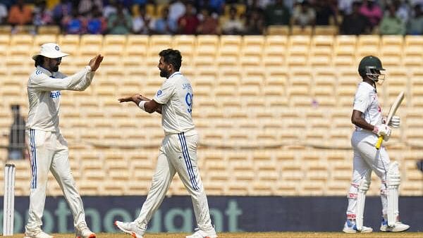 <div class="paragraphs"><p>Jasprit Bumrah celebrates with KL Rahul after taking the wicket of Bangladesh's Hasan Mahmud on the second day of the first test cricket match between India and Bangladesh, at the MA Chidambaram Stadium, in Chennai.</p></div>