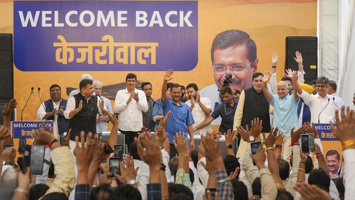 <div class="paragraphs"><p>Delhi Chief Minister Arvind Kejriwal acknowledges supporters amid rainfall after walking out of the Tihar Jail, in New Delhi.</p></div>