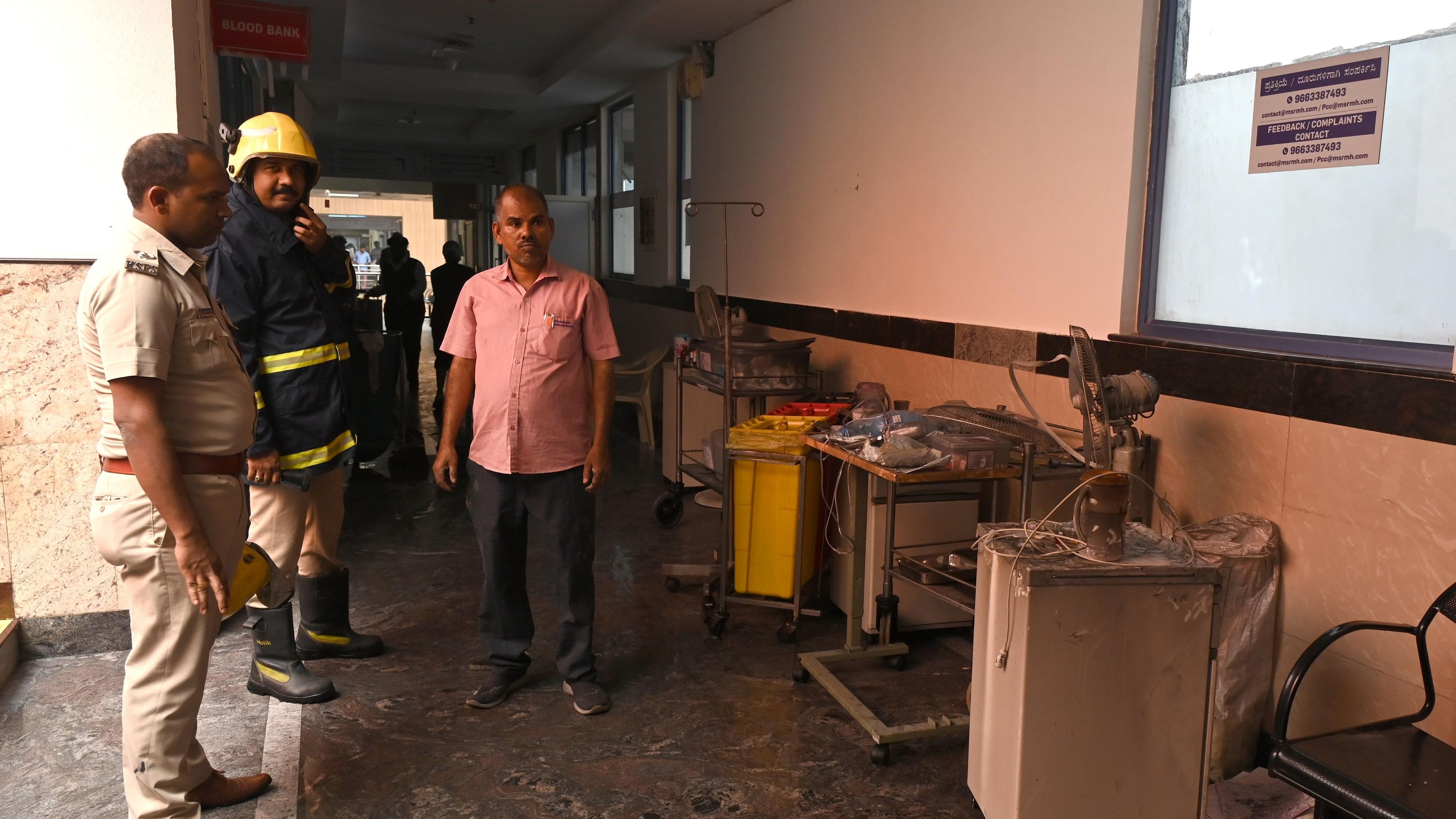 <div class="paragraphs"><p>Police personnel inspect the premises of Ramaiah Hospital after a 34-year-old patient died in a fire that erupted in the Critical Care Unit on Thursday.</p></div>