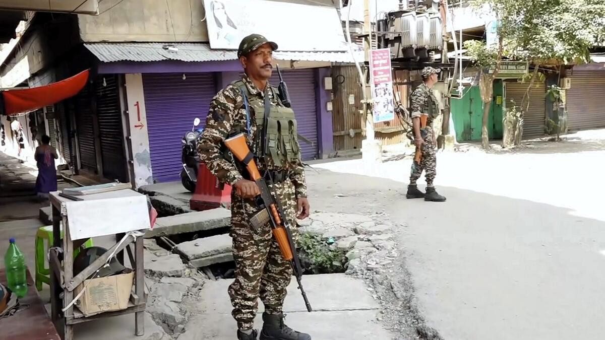 <div class="paragraphs"><p>Security personnel stand guard after a fresh violence, in Imphal. (Representative image)</p></div>