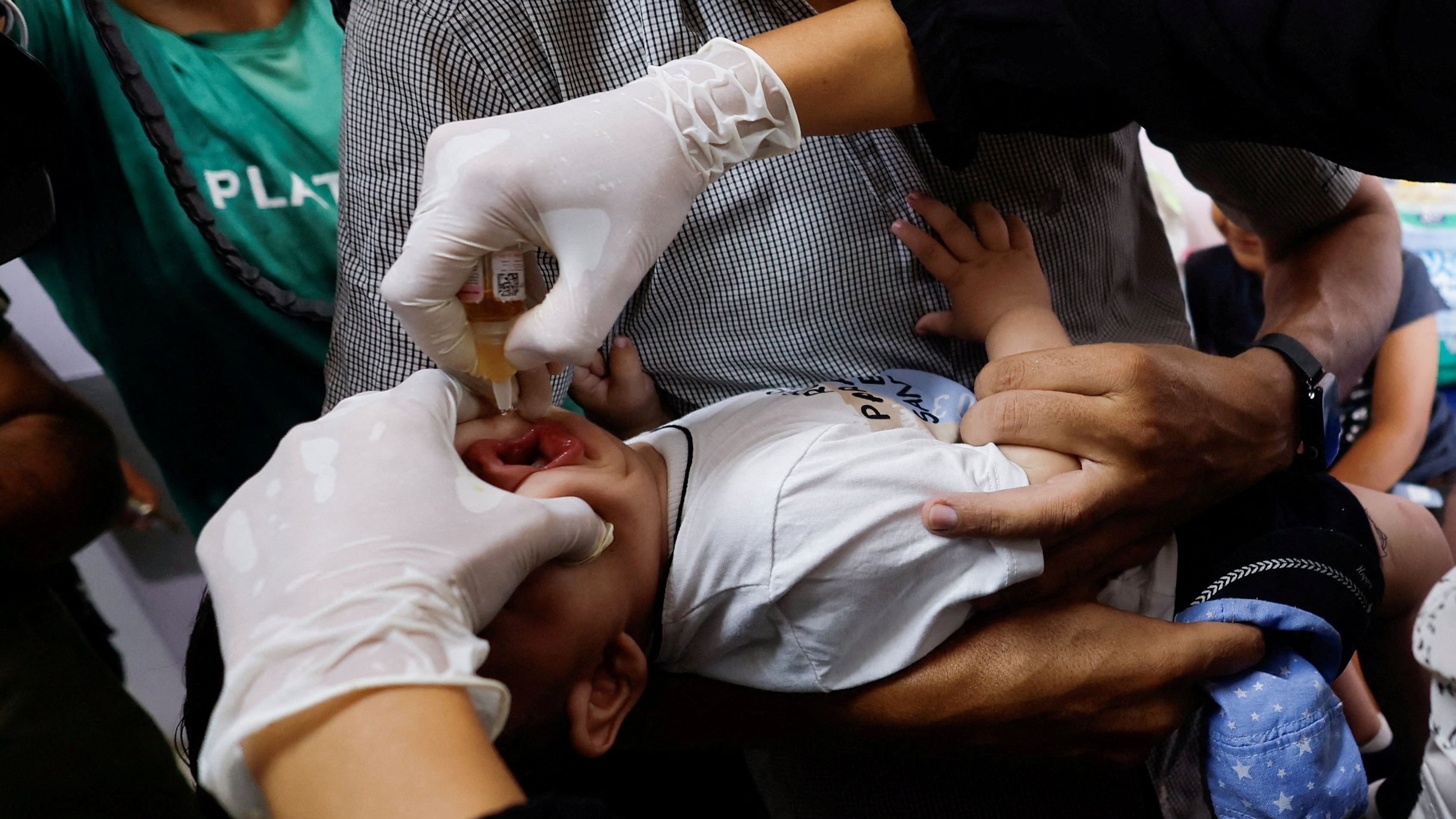 <div class="paragraphs"><p>A Palestinian child is vaccinated against polio, amid the Israel-Hamas conflict, at Nasser hospital in Khan Younis in the southern Gaza Strip.</p></div>