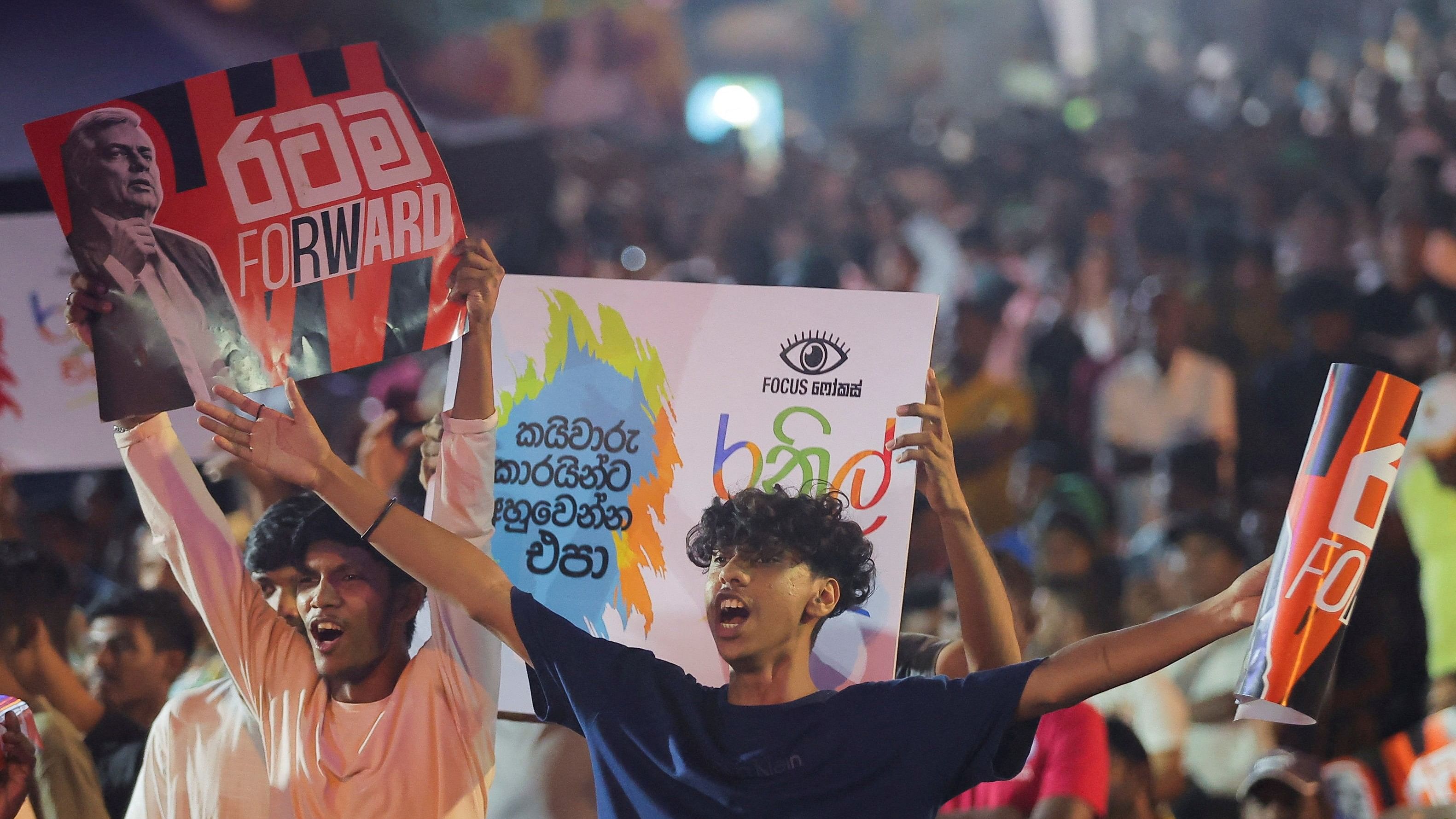 <div class="paragraphs"><p>Supporters of Sri Lanka's president Ranil Wickremesinghe react as Wickremesinghe arrives at his final election campaign rally for the upcoming presidential election, scheduled for September 21, in Colombo, Sri Lanka September 18, 2024. </p></div>