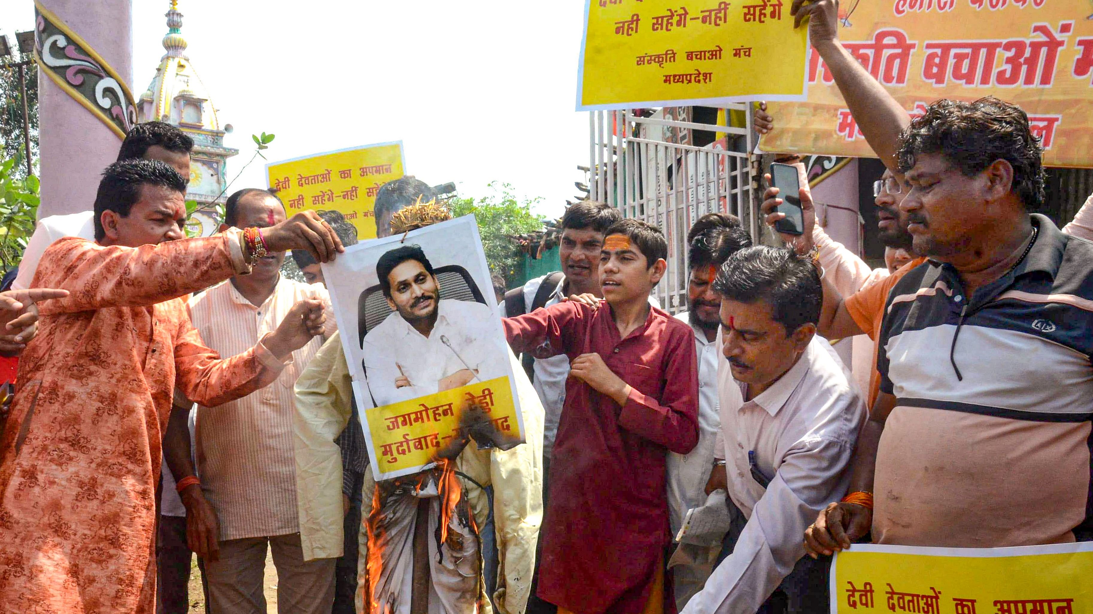 <div class="paragraphs"><p>anskriti Bachao Manch activists burn an effigy during a protest against the alleged use of animal fat in the preparation of laddoos as offerings at Tirupati Balaji temple, in Bhopal, Friday.</p></div>