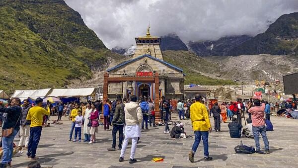 <div class="paragraphs"><p>Devotees at Kedarnath Temple. </p></div>