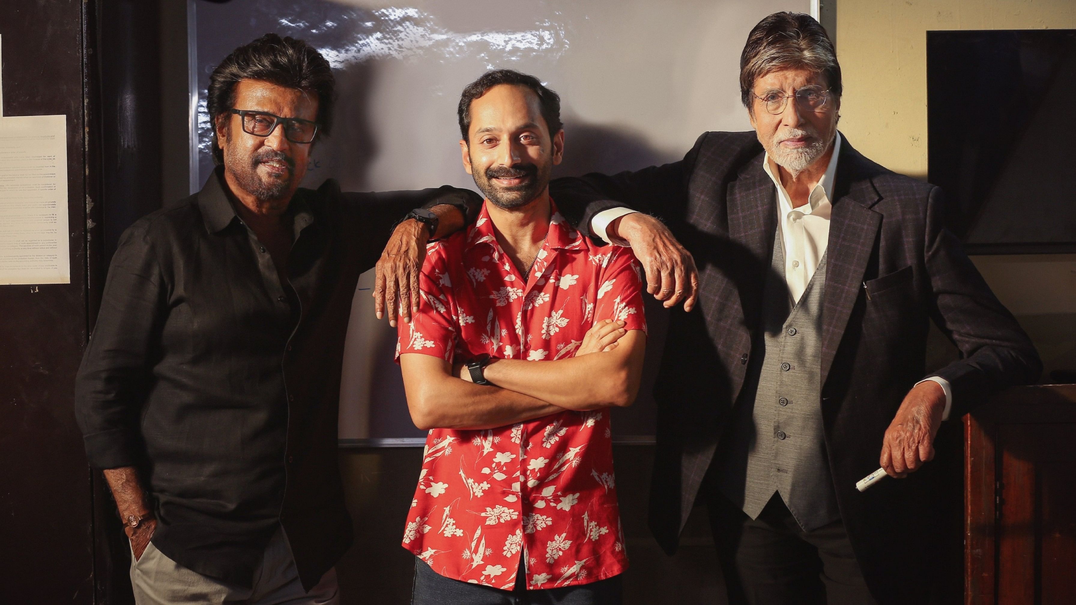 <div class="paragraphs"><p>Fahadh Faasil flanked by Amitabh Bachchan and Rajinikanth on the sets of&nbsp;<em>Vettaiyan</em>.</p></div>