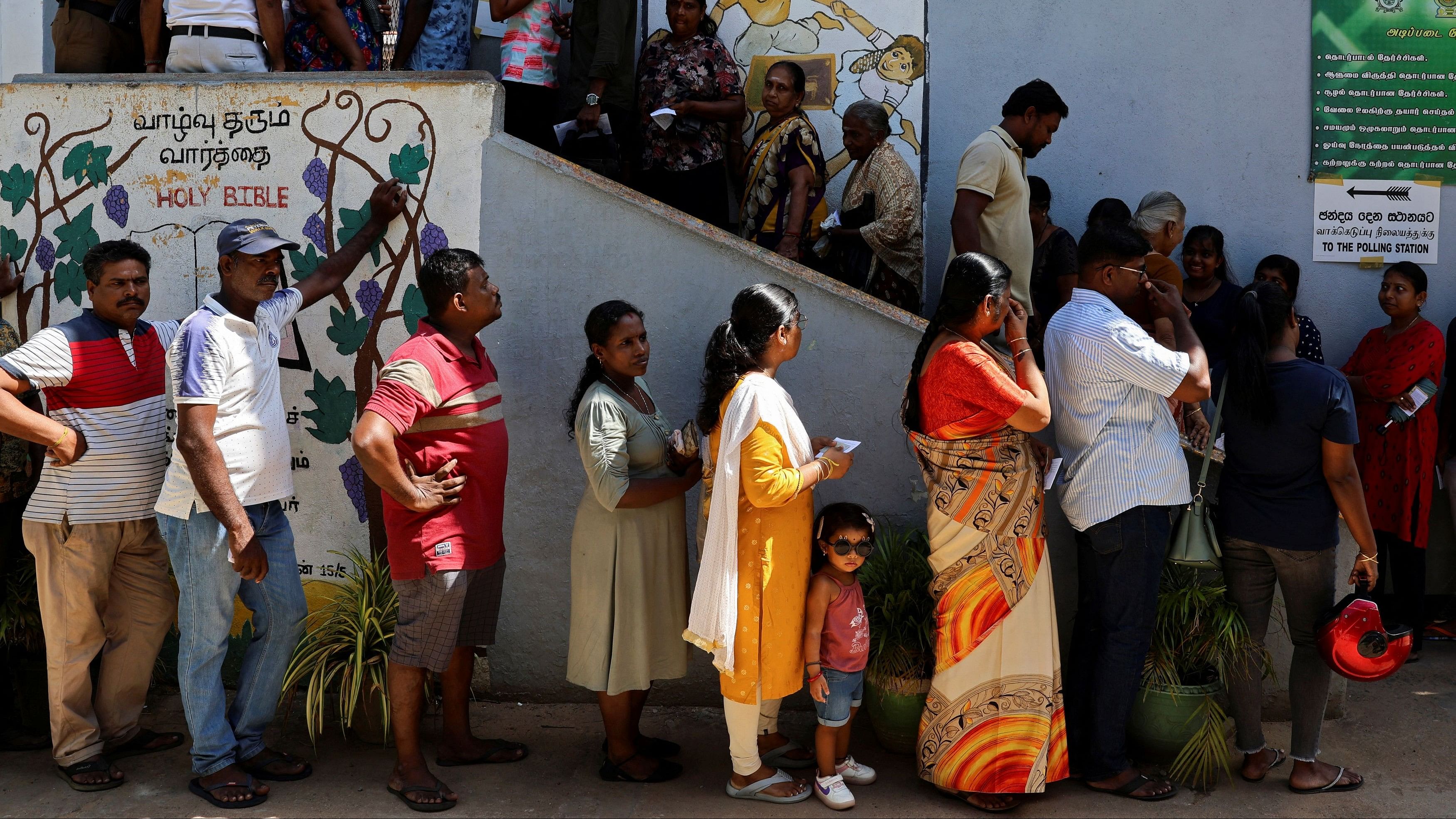 <div class="paragraphs"><p>Voters queue outside a polling station to vote on the day of the presidential election, in Colombo, Sri Lanka, September 21, 2024.</p></div>