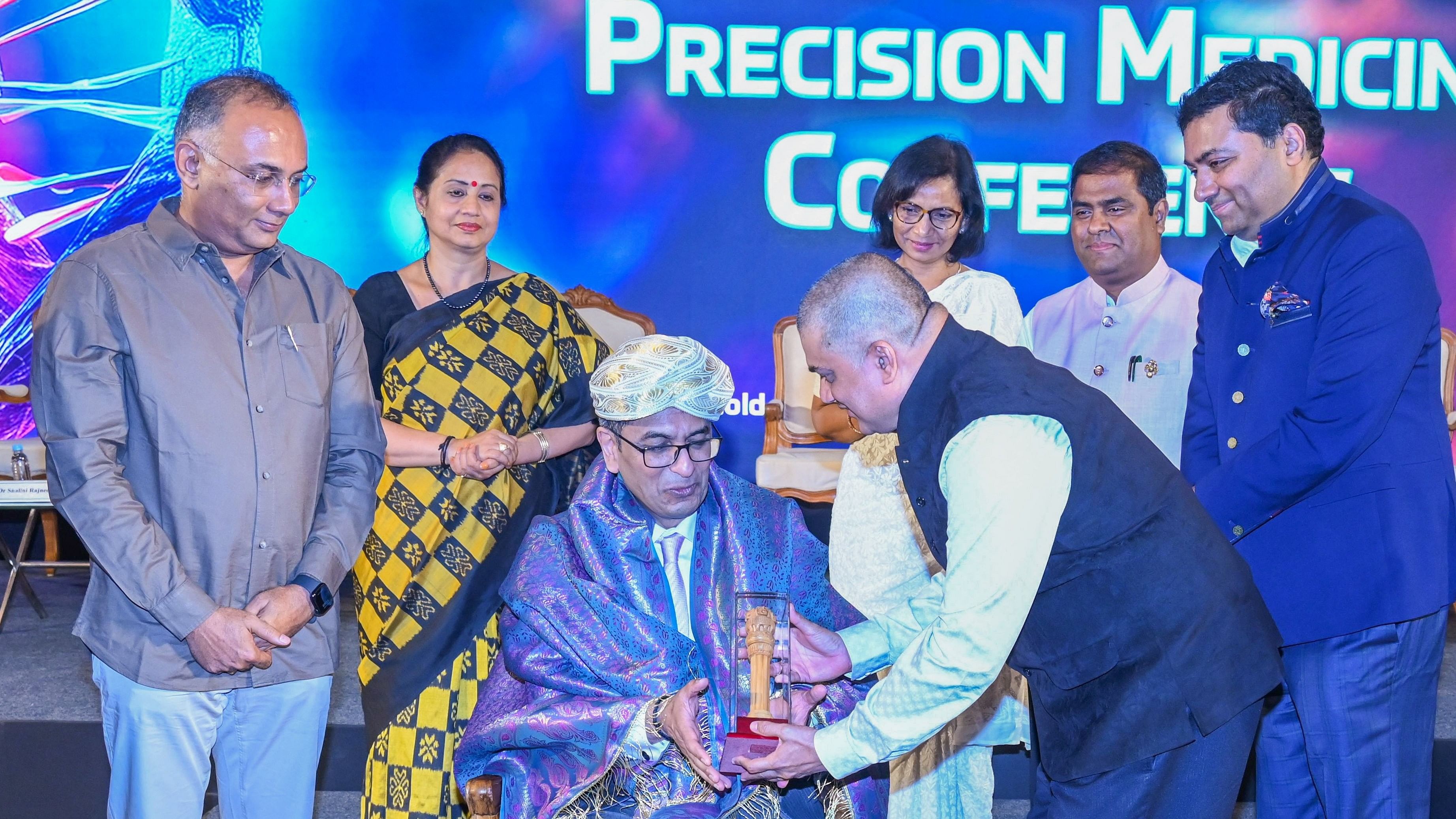 <div class="paragraphs"><p>Chief Justice of India D Y Chandrachud was honoured at a two-day conference on gene therapy in Bengaluru on Saturday. Karnataka health minister Dinesh Gundu Rao (left), looks on. </p></div>