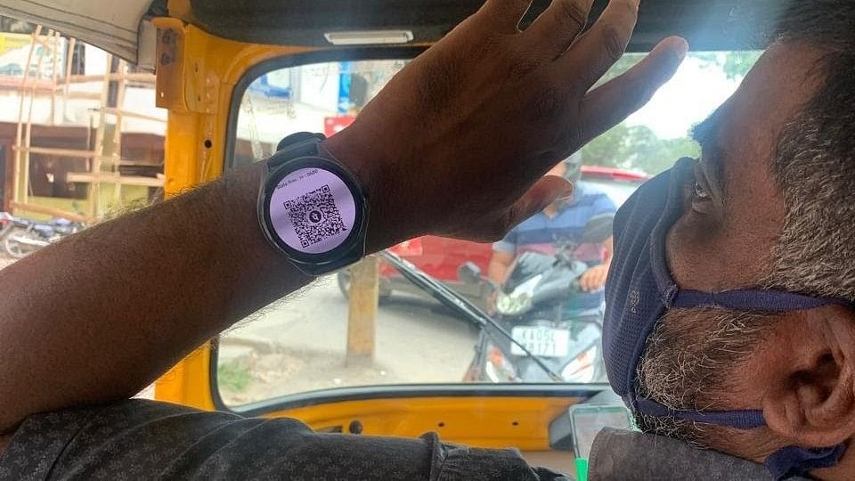 <div class="paragraphs"><p>Picture of the autorickshaw driver who accepts&nbsp;Payment Via Smartwatch QR Code.</p></div>