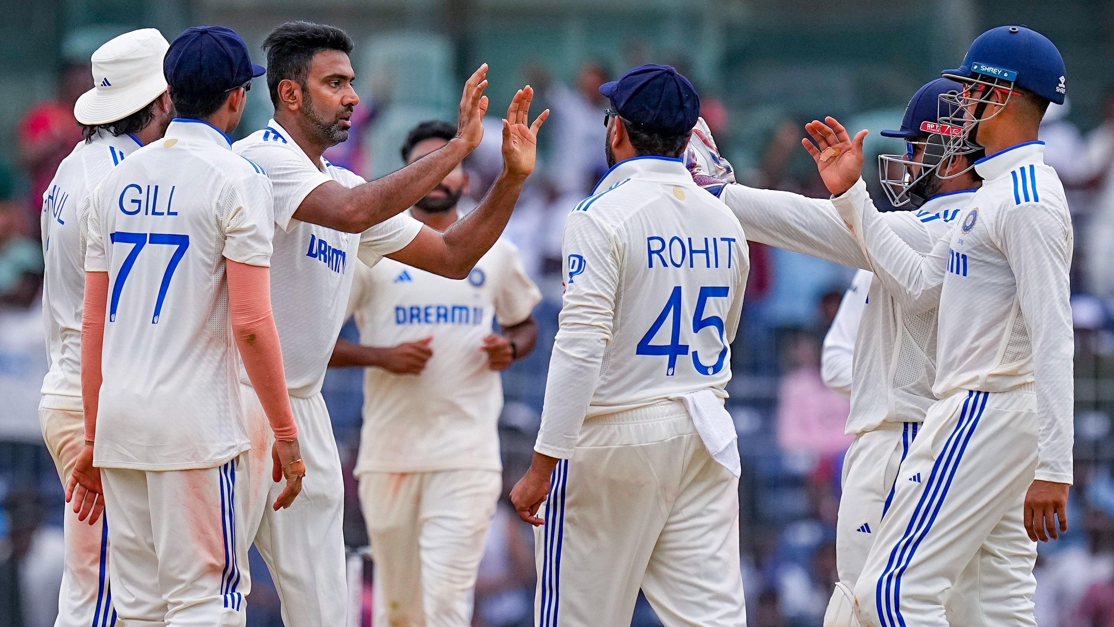 <div class="paragraphs"><p>Ravichandran Ashwin with teammates celebrates the dismissal of Bangladesh's Mominul Haque.</p></div>