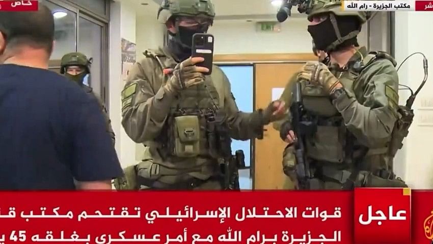 <div class="paragraphs"><p>The Qatar-based channel aired live footage of the Israeli troops storming the channel's office and handing over a military closure order to one of the <em>Al Jazeera TV</em> staff before the broadcast was disrupted.</p></div>