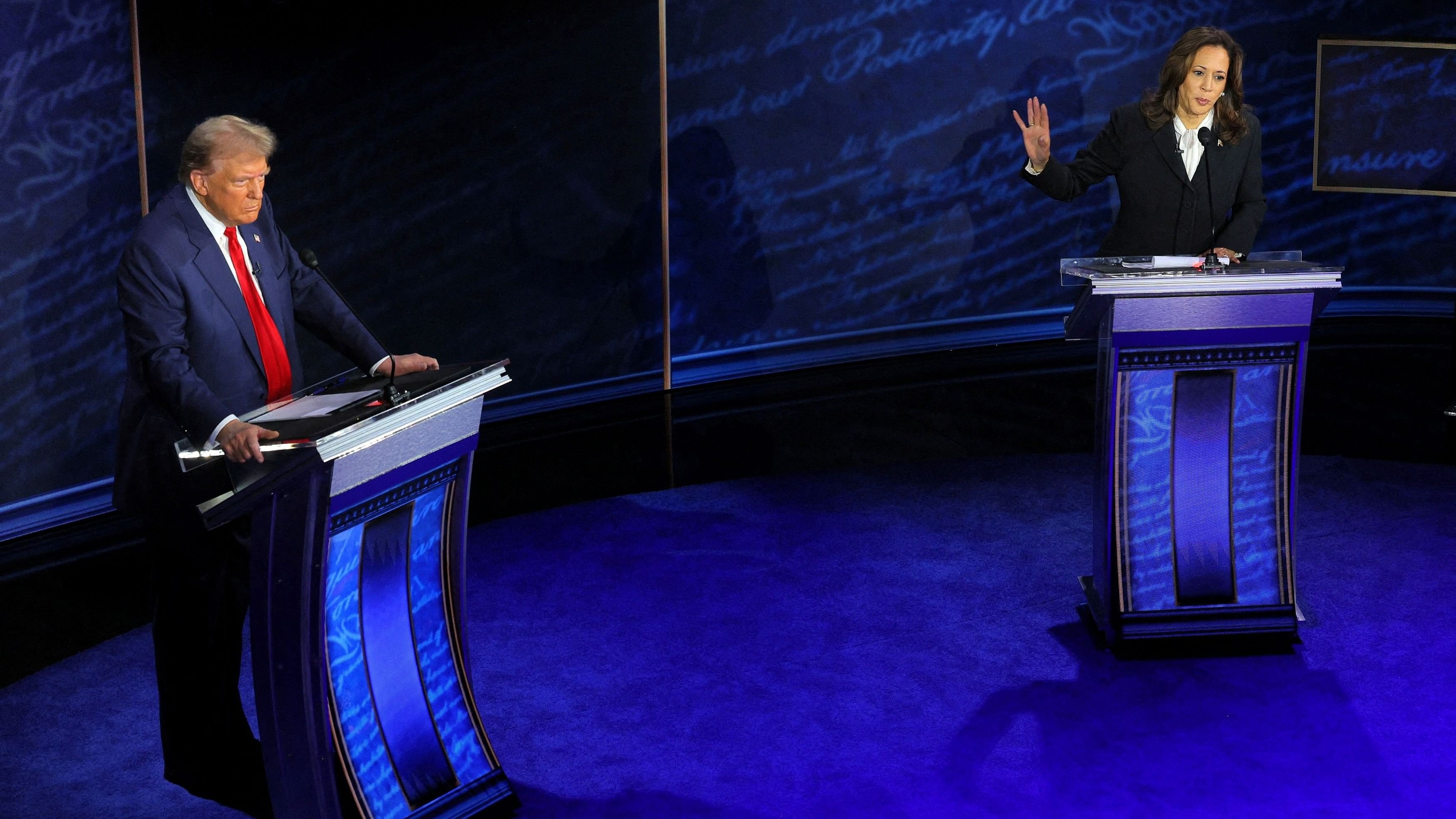 <div class="paragraphs"><p>Democratic presidential nominee, US Vice President Kamala Harris speaks during a presidential debate hosted by ABC as Republican presidential nominee, former US President Donald Trump listens, in Philadelphia, Pennsylvania, US</p></div>