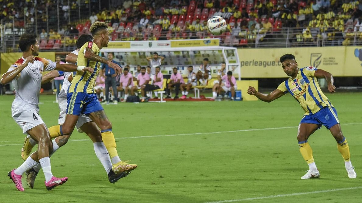 <div class="paragraphs"><p>Players of Kerala Blasters FC (in yellow) and East Bengal FC vie for the ball during their Indian Super League 2024-25 football match, in Kochi.</p></div>