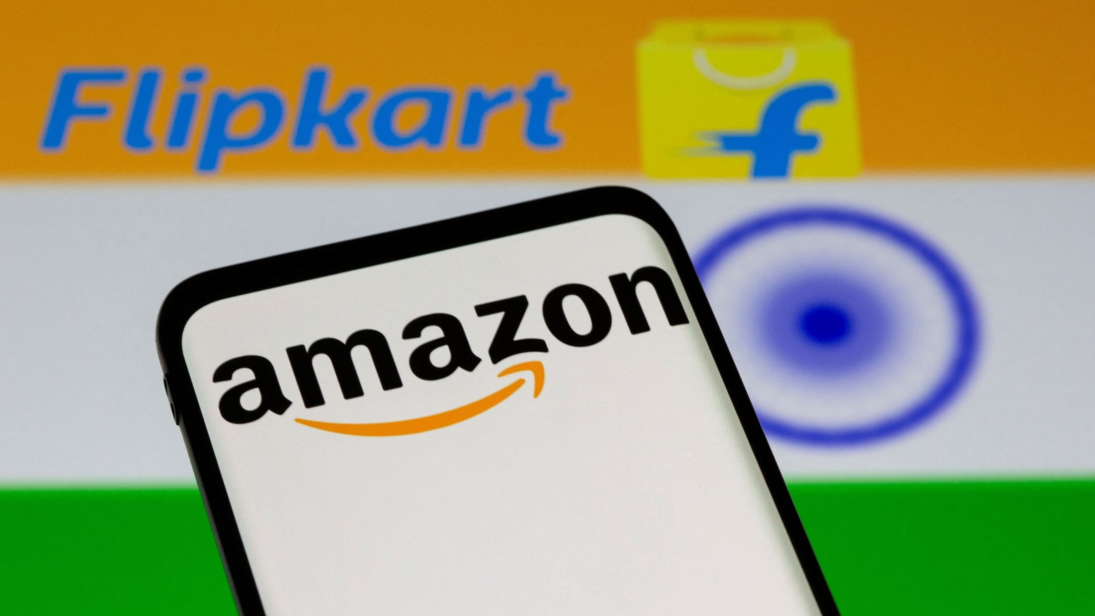 <div class="paragraphs"><p>Smartphone with Amazon logo is seen in front of displayed Flipkart logo and Indian flag in this illustration.</p></div>