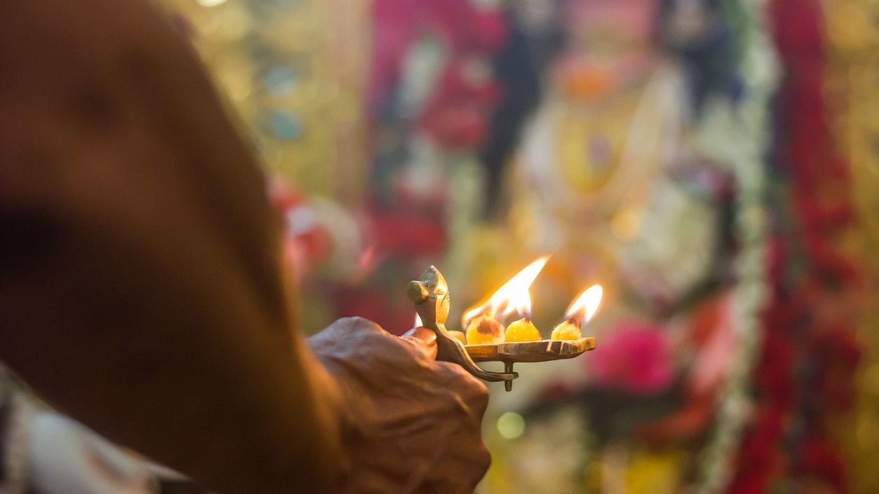 <div class="paragraphs"><p>Representative image of a temple priest in front of the deity.&nbsp;</p></div>