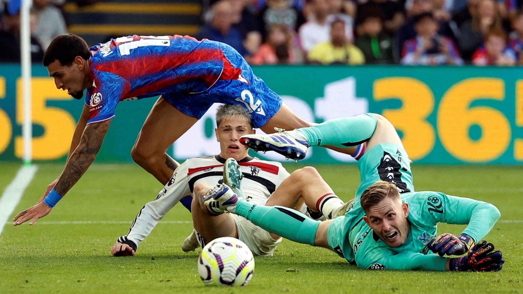 <div class="paragraphs"><p> Crystal Palace's Dean Henderson in action with Manchester United's Alejandro Garnacho </p></div>