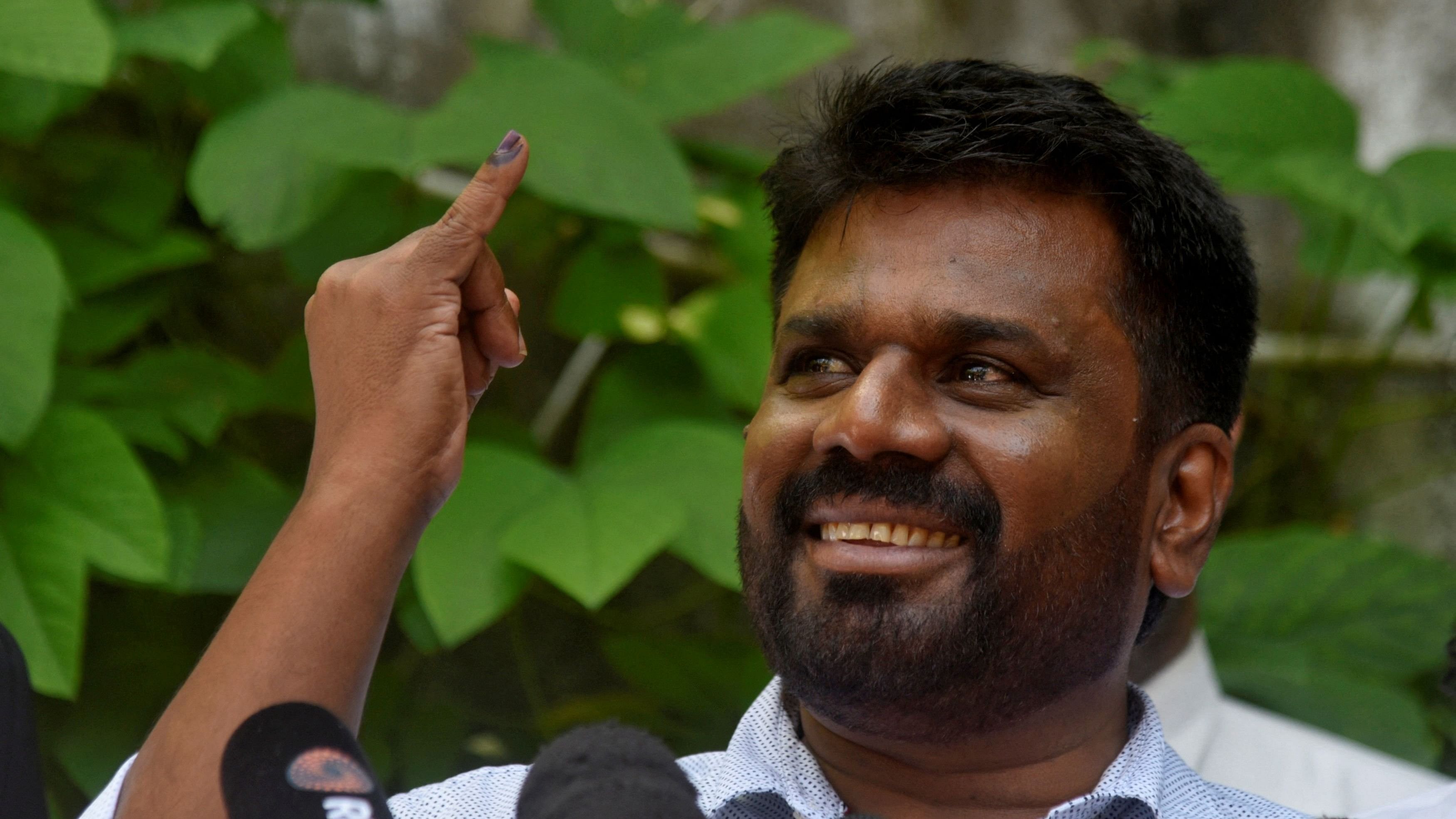 <div class="paragraphs"><p>Anura Kumara Dissanayake, the presidential candidate from National People's Power, shows his ink-marked finger after casting his vote at a polling station, on the day of the presidential election, in Colombo, Sri Lanka, September 21, 2024. </p></div>