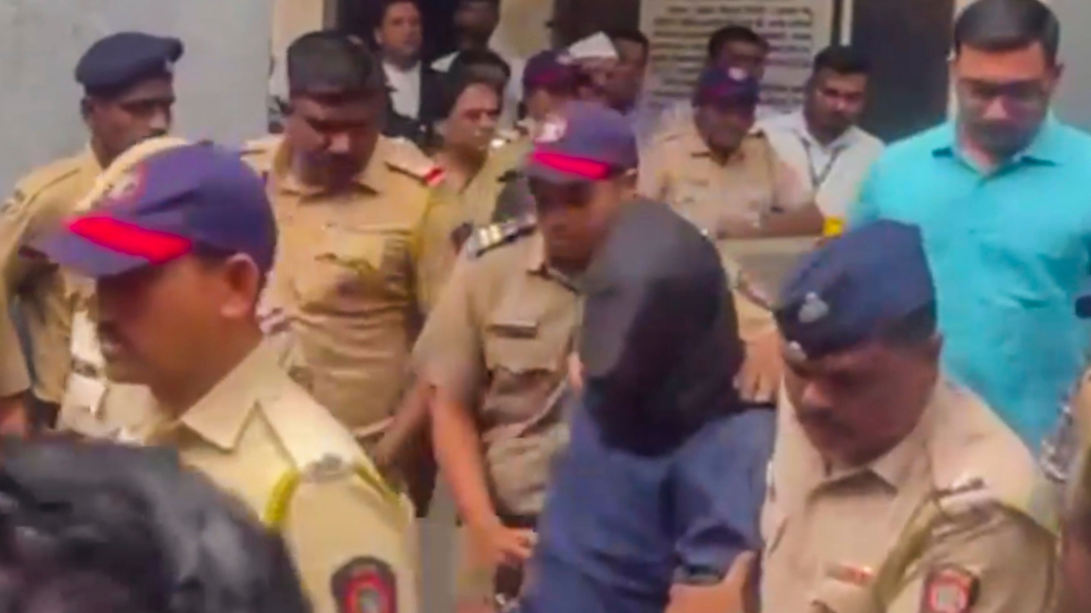 <div class="paragraphs"><p> Badlapur sexual abuse case accused with police personnel leaves after being sent to judicial custody for 14 days by a Kalyan Court.</p></div>