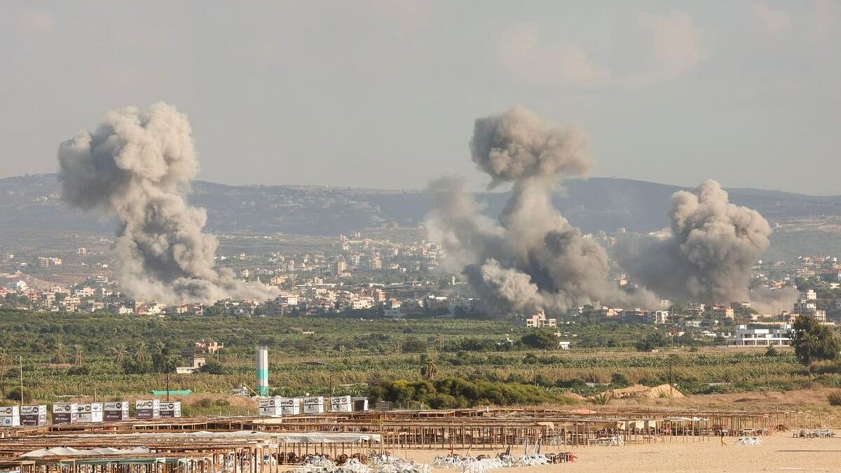 <div class="paragraphs"><p>Smokes rise, amid ongoing cross-border hostilities between Hezbollah and Israeli forces, in Tyre.</p></div>